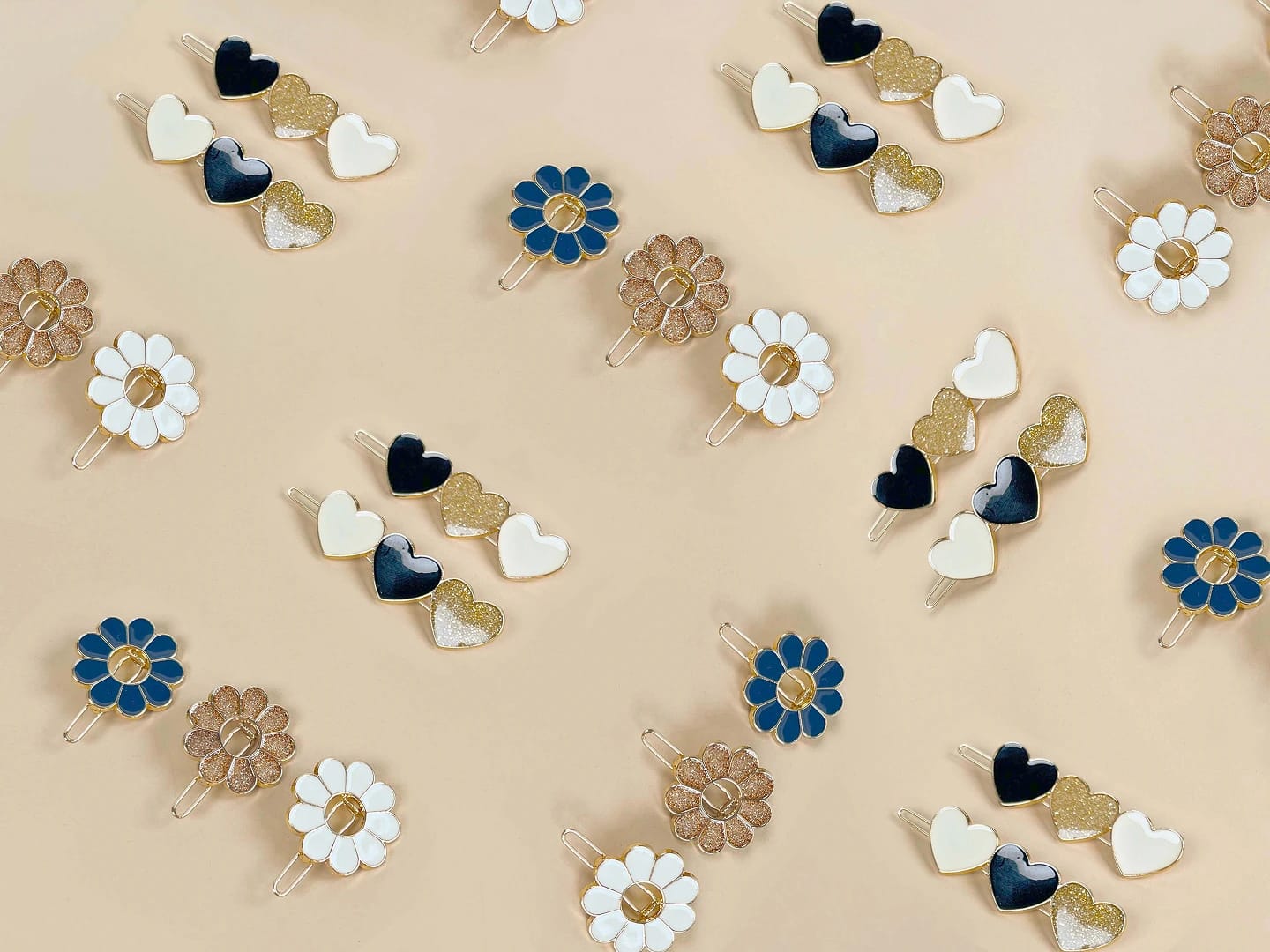 A stylish assortment of hair accessories, including flower-shaped clips, promoting Tape à l'oeil